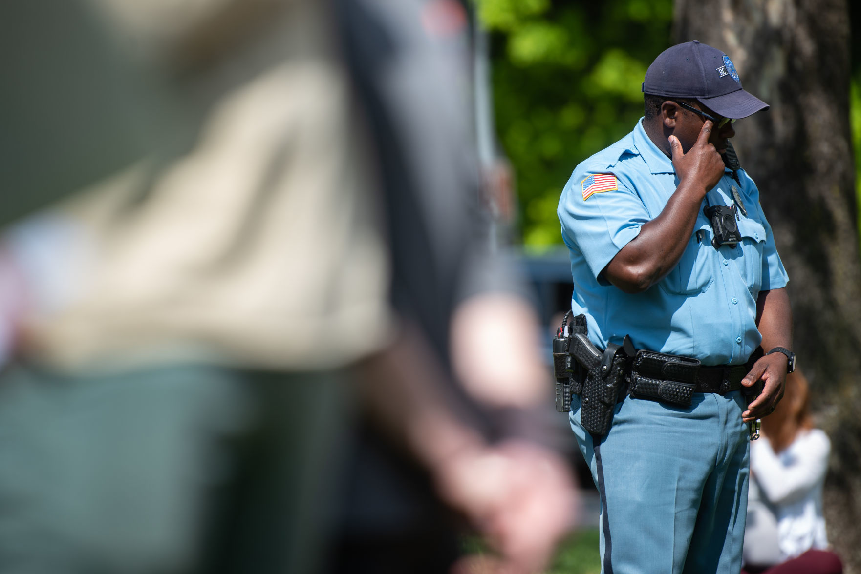 RCPDÕs Officer Tyrone Townsend stands in Triangle Park at the peaceful protest in honor of George Floyd on Saturday.